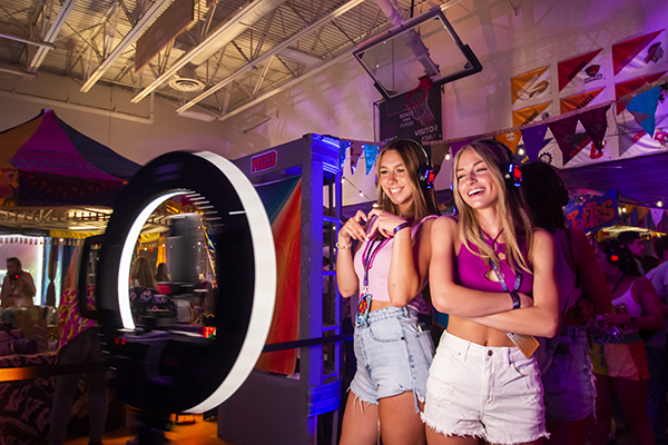 Image of two girls using 360 photo kiosk