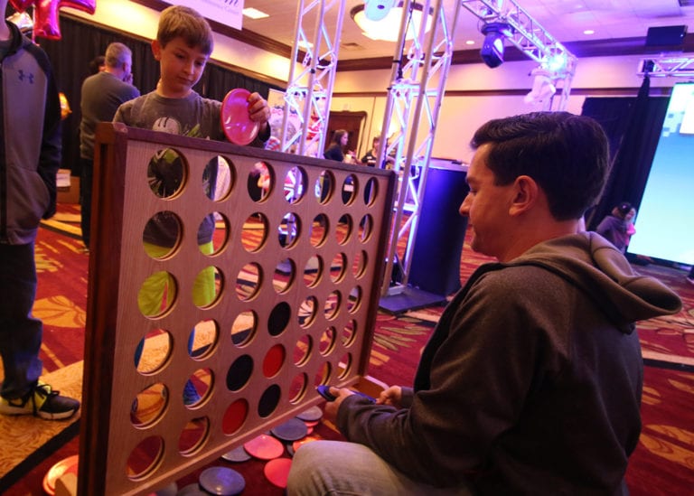 Image of kid playing Giant Connect 4